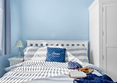 bedroom with book and breakfast on bed